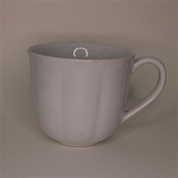 A big rounded cup with a handle facing right 
                            A plain white cup with a wavy structure 
                            An empty cup in studio