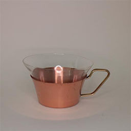 A small concave cup with a golden handle facing right 
                            A copper cup with a glass insert 
                            An empty cup in studio