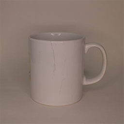 A cylindric cup with a handle facing right 
                            A white cup with a washed out yellow and blue logo 
                            An empty cup in studio