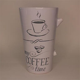A very high cup with the broken of handle facing right 
                            A white cup with grey coffeeshop lettering and illustration 
                            An empty cup in studio