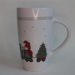 A very high cone shaped cup with a handle facing right 
                            A white cup with a Christmas print 
                            An empty cup in studio