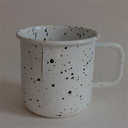 A cylindric camping cup with a handle facing right 
                            A white cup with tiny black dots 
                            An empty cup in studio