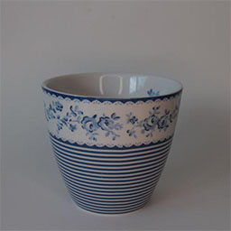 A rounded cone shaped cup without a handle 
                            A white and blue cup printed with horizontal stripes and flowers 
                            An empty cup in studio