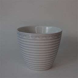 A rounded cone shaped cup without a handle 
                            A white and beige cup printed with horizontal stripes and ornaments 
                            An empty cup in studio