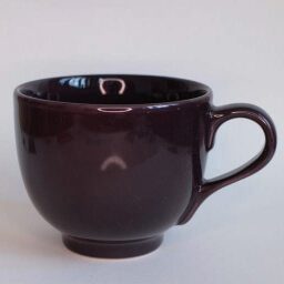 Plain clear empty round dark brown cup handle right