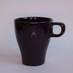 Plain clear empty conic brown cup handle left